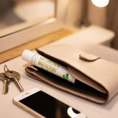 Naturistick lip balm ingredients list shows natural oils and beeswax.