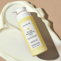 Naturium lotion massaged on forearm showing non-greasy finish.