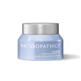 Naturopathica Pumpkin Purifying Enzyme Peel bottle on vanity for at-home pore care.