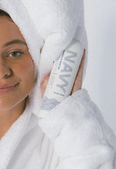 Ingredients panel featuring rosemary oil and vitamins on NAVY shampoo