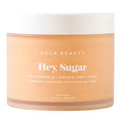 NCLA Beauty Hey Sugar bottle and spread demonstrates mango butter richness for hydration.