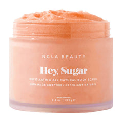 NCLA Beauty Hey Sugar peach scrub jar close-up shows creamy texture for exfoliation and hydration.