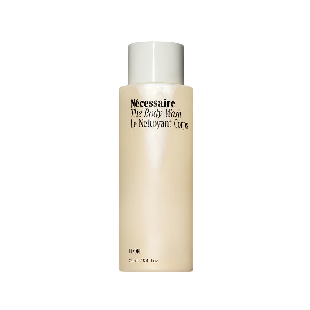 Nécessaire Hinoki body wash bottle foaming lather delivering a soothing, non-drying cleanse.