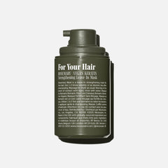 Nécessaire Rosemary Leave-In Mask texture close-up showing creamy repair formula.