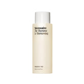 Nécessaire shampoo bottle front view for daily cleansing.