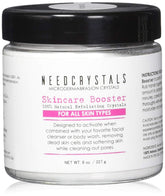 NeedCrystals microdermabrasion jar close-up showing exfoliating crystals for smoother skin