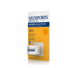 Neosporin Lip Health on a nightstand during nightly routine.