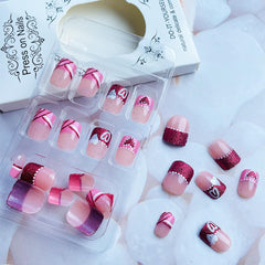 NEWSPIED French tip nails offering a timeless look at home.