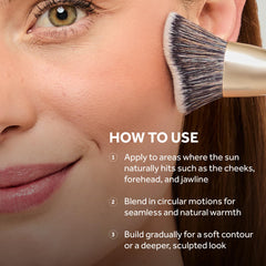 Apply No7 bronzer to cheeks and jawline with a fluffy brush for contour and warmth