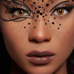 nooepc rhinestones applied to eye makeup for festival glam