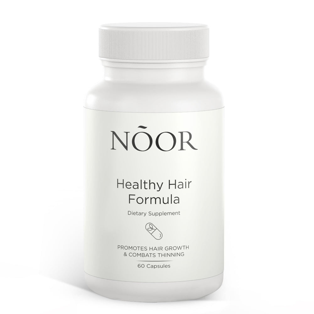 NOOR HAIR Healthy Hair Formula bottle showing daily nourishment for fuller growth.