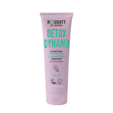 Noughty Detox Dynamo clarifying shampoo bottle pours with a refreshing peppermint scent for residue removal.