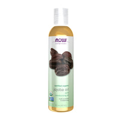 NOW Solutions Organic Jojoba Oil bottle in clear UV-protected packaging.
