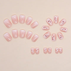 OCOUYVD square nails with flower design in a soft pastel gradient for party-ready style.