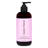OfficeKit Cedar + Stone Clean Body Wash bottle being poured for a hydrating cleanse.
