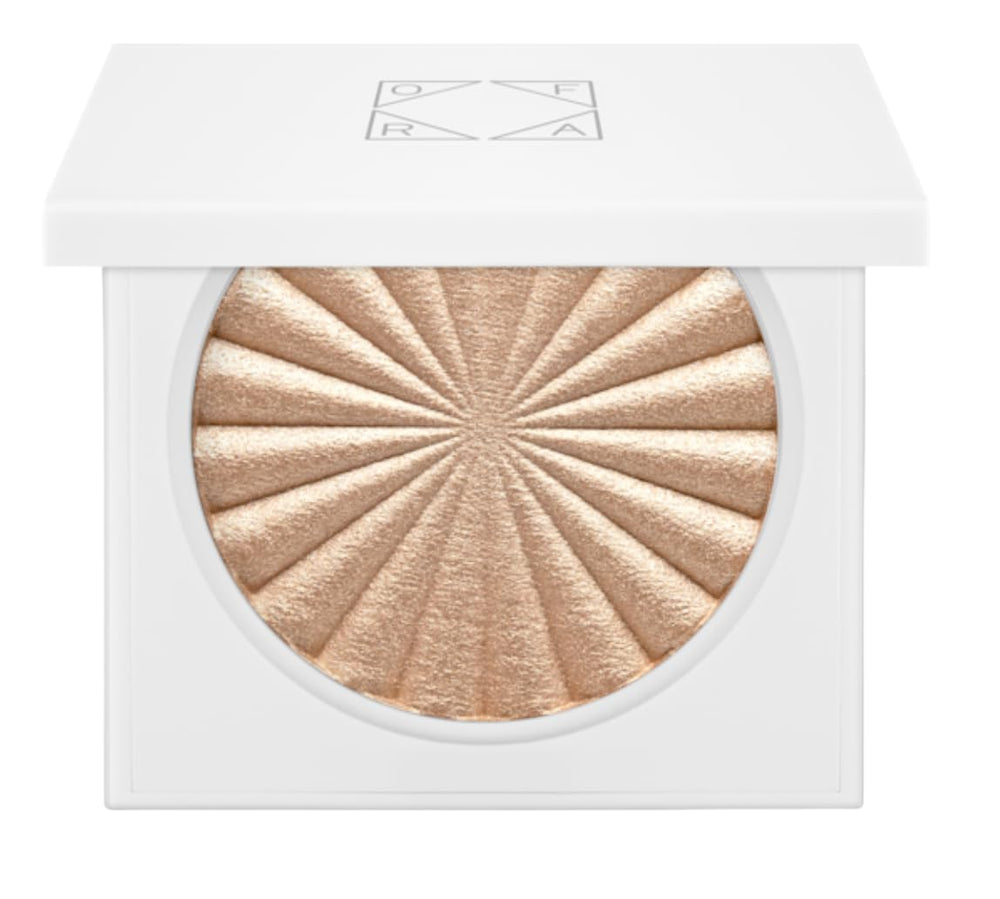 Ofra highlighter Rodeo Drive bottle swatch showing champagne glow
