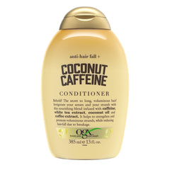 OGX Anti-Hair Fall bottle on shelf highlights coconut caffeine conditioner benefits.
