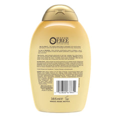 Rich lather from OGX shampoo visible while cleansing and boosting strand resilience.