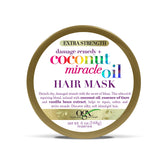 OGX Damage Remedy Coconut Miracle Oil Mask bottle for deep conditioning and smoother strands.