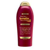 OGX Frizz-Free Keratin Shampoo bottle front, promising frizz control.