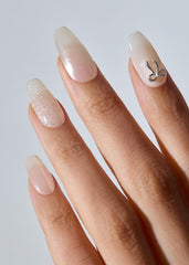 ohora N Eternal Shine nail wraps under LED lamp being cured for lasting results