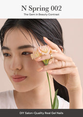 Close-up of Ohora N Bare Peach application showing a nail wrap being placed.