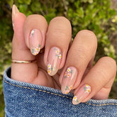 OHWODA Pink Spring press-on nails with daisy flowers for a quick, elegant manicure.