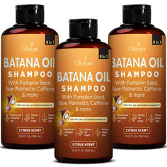 Okaga Batana Oil Shampoo bottle being poured for gentle cleansing