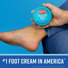 Applying O'Keeffe's Healthy Feet to dry feet for moisture relief