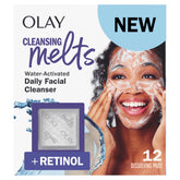 Olay Cleansing Melts pad dissolving in warm water to start a gentle cleanse.