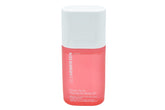 Ole Henriksen Firmly Yours dry body oil bottle ready for hydration on a bathroom shelf.
