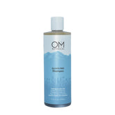OM Botanical sulfate-free shampoo bottle pouring for a color-safe cleanse