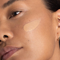 OneSkin OS-01 Shield application texture on skin shows smooth absorption.