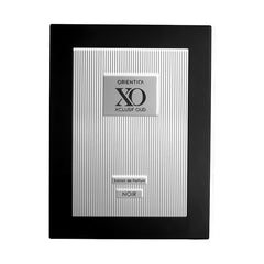 Orientica XO Xclusif Oud Noir top notes display spicy-sweet opening.