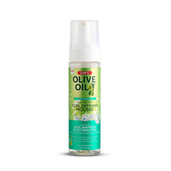 ORS Olive Oil Max Moisture Mousse bottle on shelf for hydrated, defined curls.
