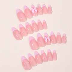OSTTMA pink French tip press-on nails with bow pearls for effortless style