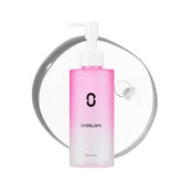 Overlaps Pink Desert Ectoin Cleansing Oil bottle close-up showing makeup removal benefits