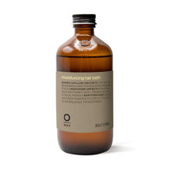 OWAY moisturizing hair bath bottle demonstrates hydration and gentle cleansing for dry hair.