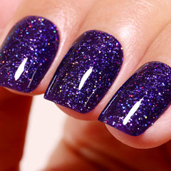 Ozzeal deep purple iridescent glitter nail polish bottle showing sparkling color