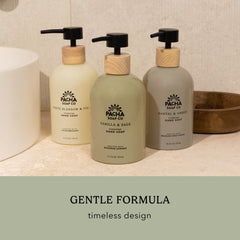 Person holding Vanilla & Sage bottle for daily use