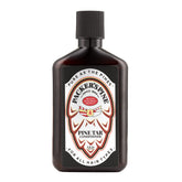 Packer's Pine Tar Conditioner bottle with pine needles promotes moisturized, manageable hair.