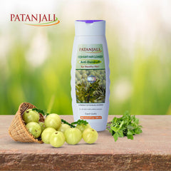 Patanjali Kesh Kanti label close-up showing herbal extracts and vitamins for nourishment