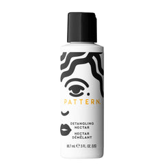 PATTERN Detangling Nectar bottle pour shows smooth slip for easy detangling.