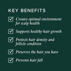 Applying Philip Kingsley Density Preserving Serum to the scalp for healthier follicles.