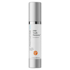 Photozyme DNA Youth Recovery Serum bottle on a clean surface, suggesting daily skincare routine.