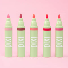 Applying Pixi LipBlush Purity on lips for a sheer finish.