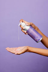 Refillable aluminum bottle with pump by Plaine Products reduces plastic waste.