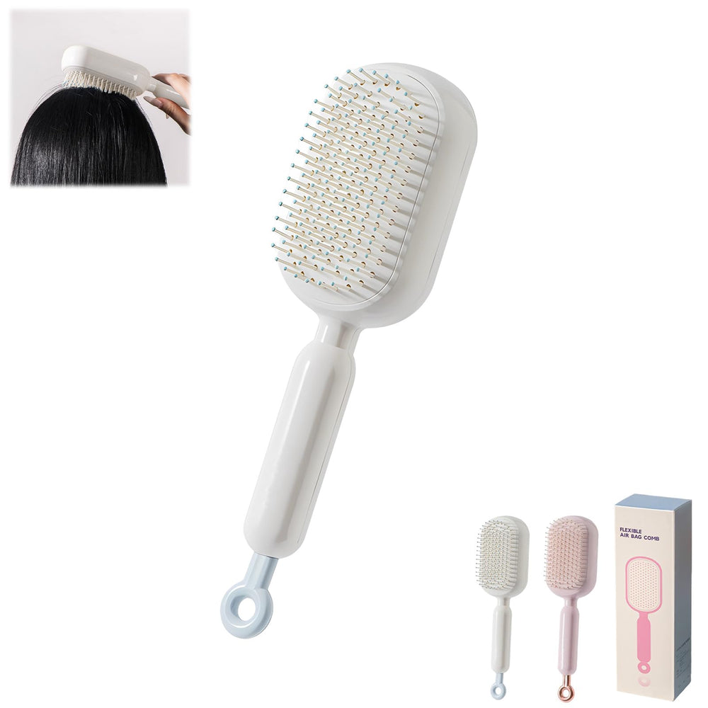 PMDYBY pink retractable cushion massage comb for on-the-go detangling and scalp comfort.