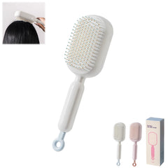 PMDYBY pink retractable cushion massage comb for on-the-go detangling and scalp comfort.