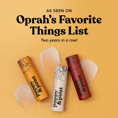 Poppy & Pout ingredient close-up with beeswax, vitamin E, and coconut oil.